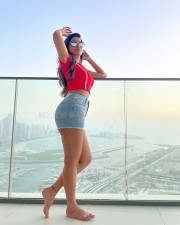 Sexy Ashu Reddy in a Red Crop Top and Mini Denim Shorts Photos 04