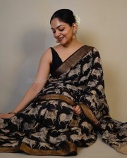 Actress Ahaana Krishna in a Black Printed Saree with a Sleeveless Black Blouse Photos 01