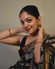 Actress Ahaana Krishna in a Black Printed Saree with a Sleeveless Black Blouse Photos 03
