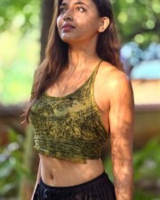 Simple and Stylish Tejasswi Prakash in a Green Tank Top and Black Palazzo Photo 01