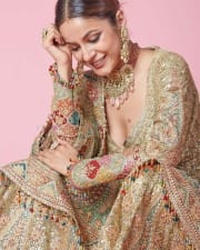 Bollywood Actress Shehnaaz Gill in a Golden Ethnic Sharara Photos 01