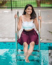 Sexy Ananthika Sanilkumar in a White Crop Top and Mini Skirt By the Pool Photos 02