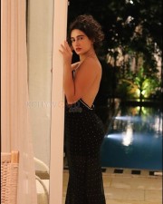 Enchanting Megha Shukla in a Printed Black Deep Neck Maxi Dress Photos 02