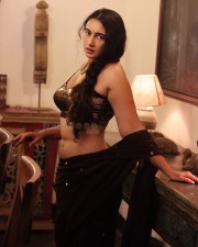 Sexy Damsel Megha Shukla in a Black Saree with a Shimmery Sleeveless Blouse Pictures 02